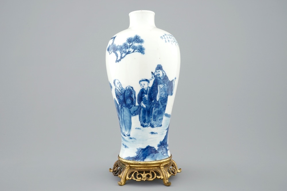 A Chinese blue and white meiping vase on gilt bronze stand, 19th C.